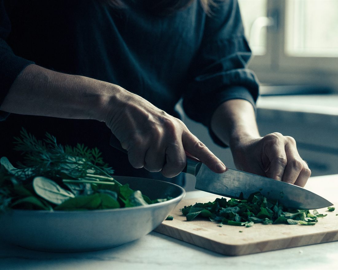 A woman preparing a fresh meal at home